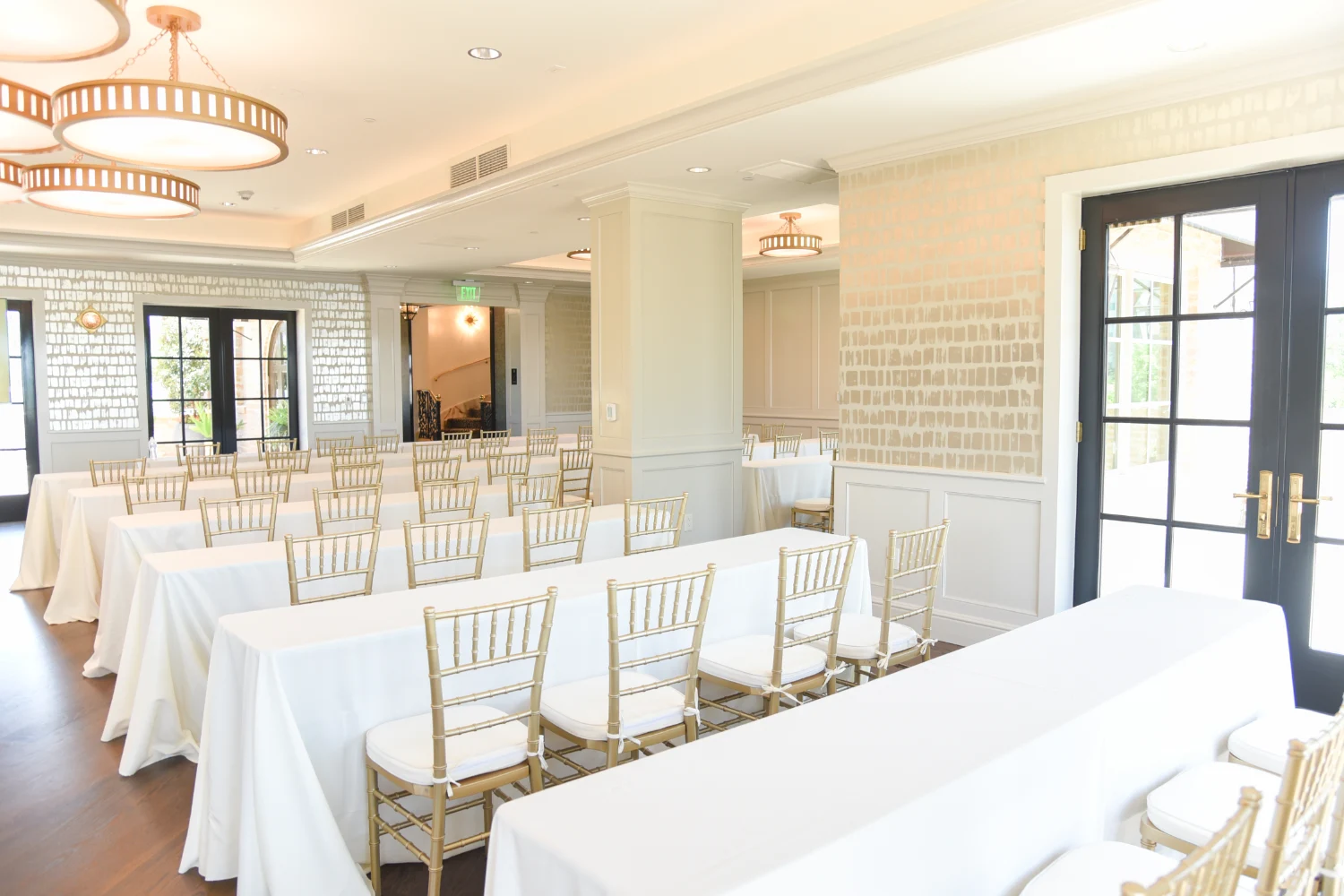 The Red Berry Estate setup for a conference with long tables and chairs