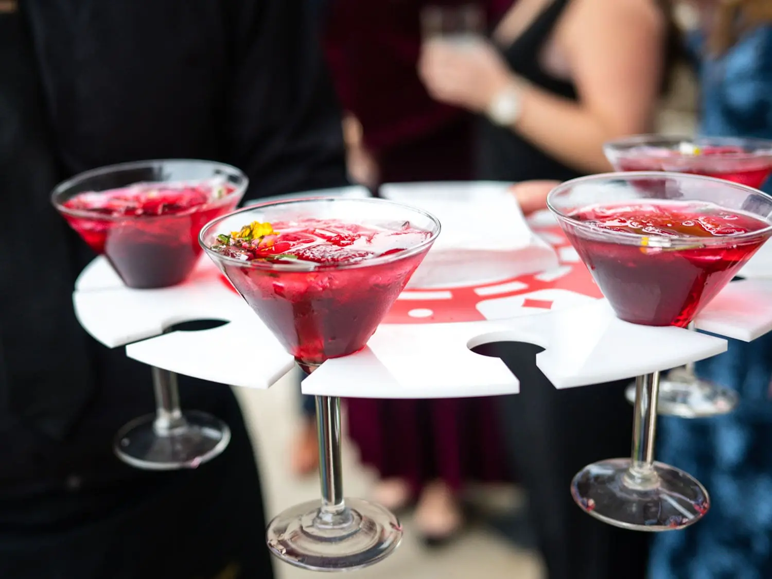Red signature cocktails served in martini glasses by tray during a reception at The Red Berry Estate.
Photo: Parish Photography