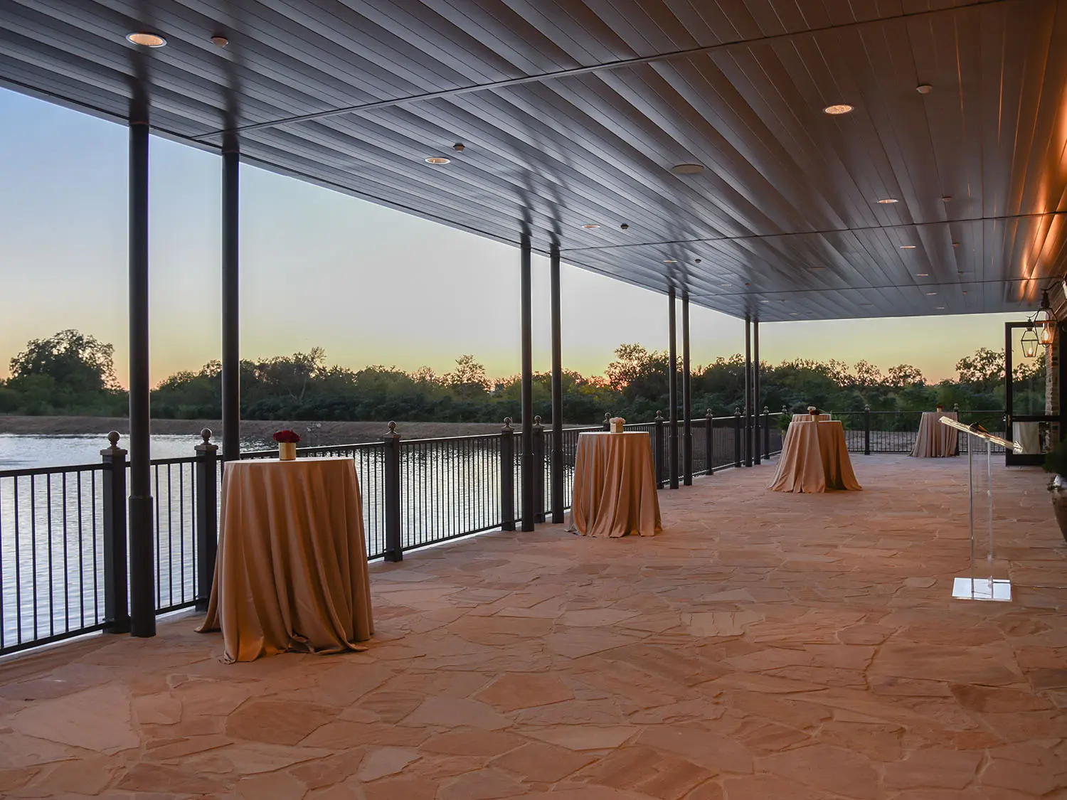 Red Berry Lakeside veranda decorated with cocktail tables