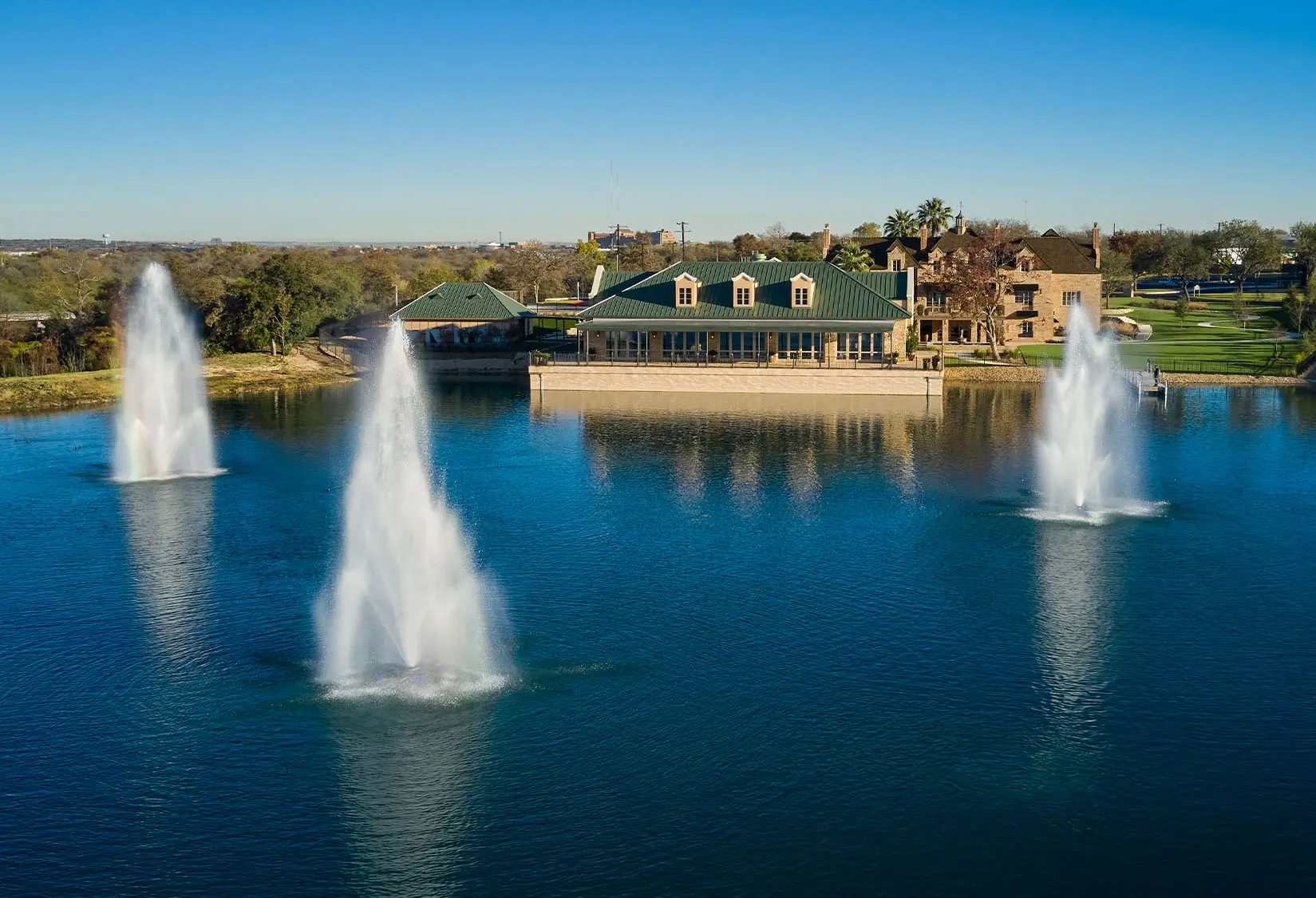 Fountains on the lake at Red Berry Estate