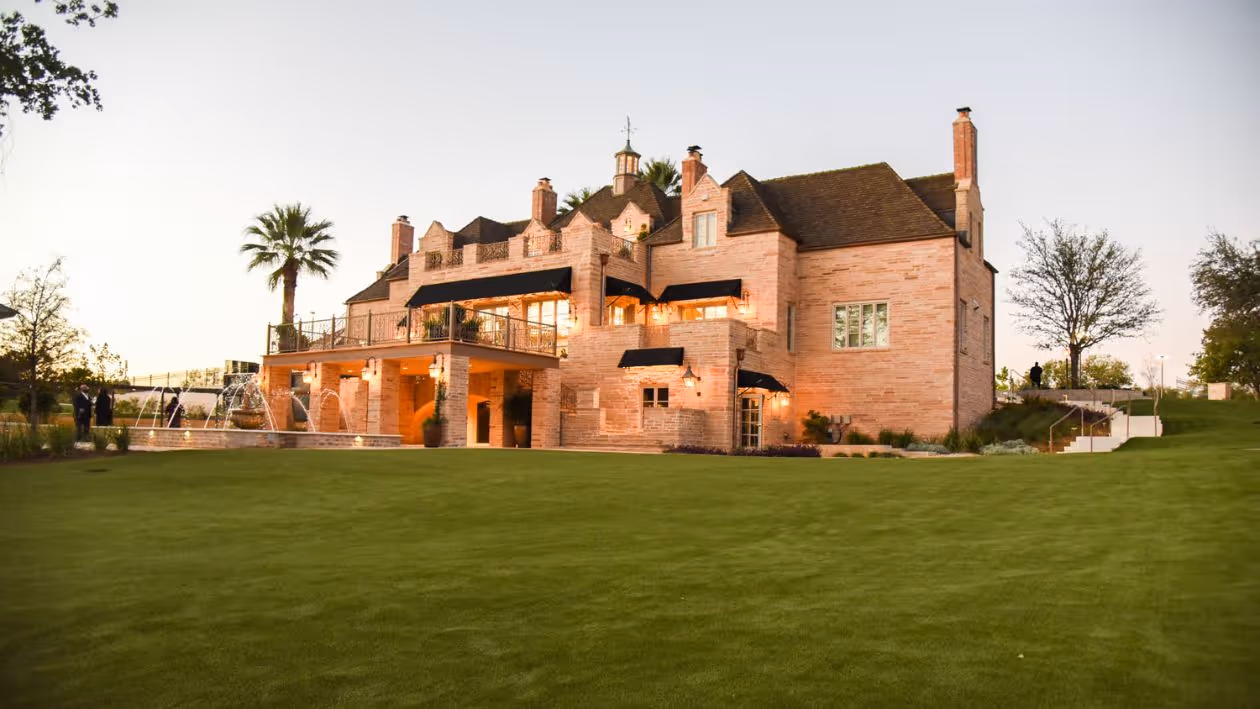 Dusk view of the back of The Red Berry Estate from the lawn