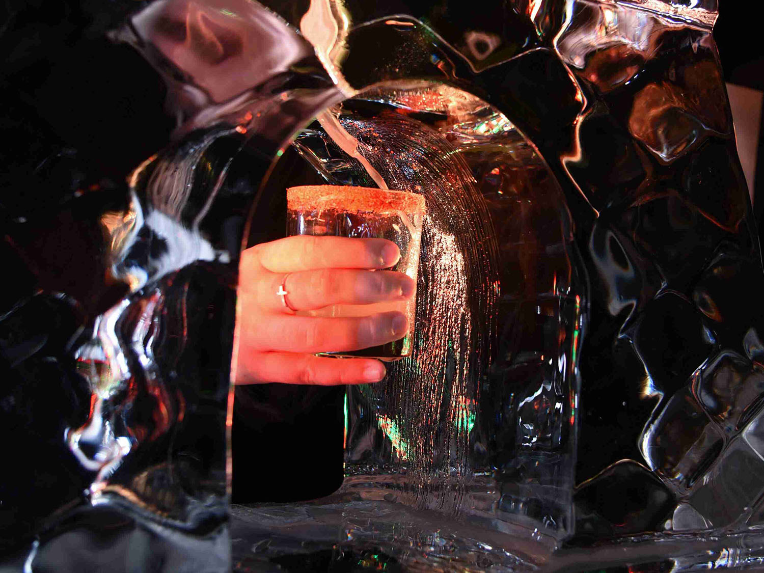 drink being handed through an ice sculpture