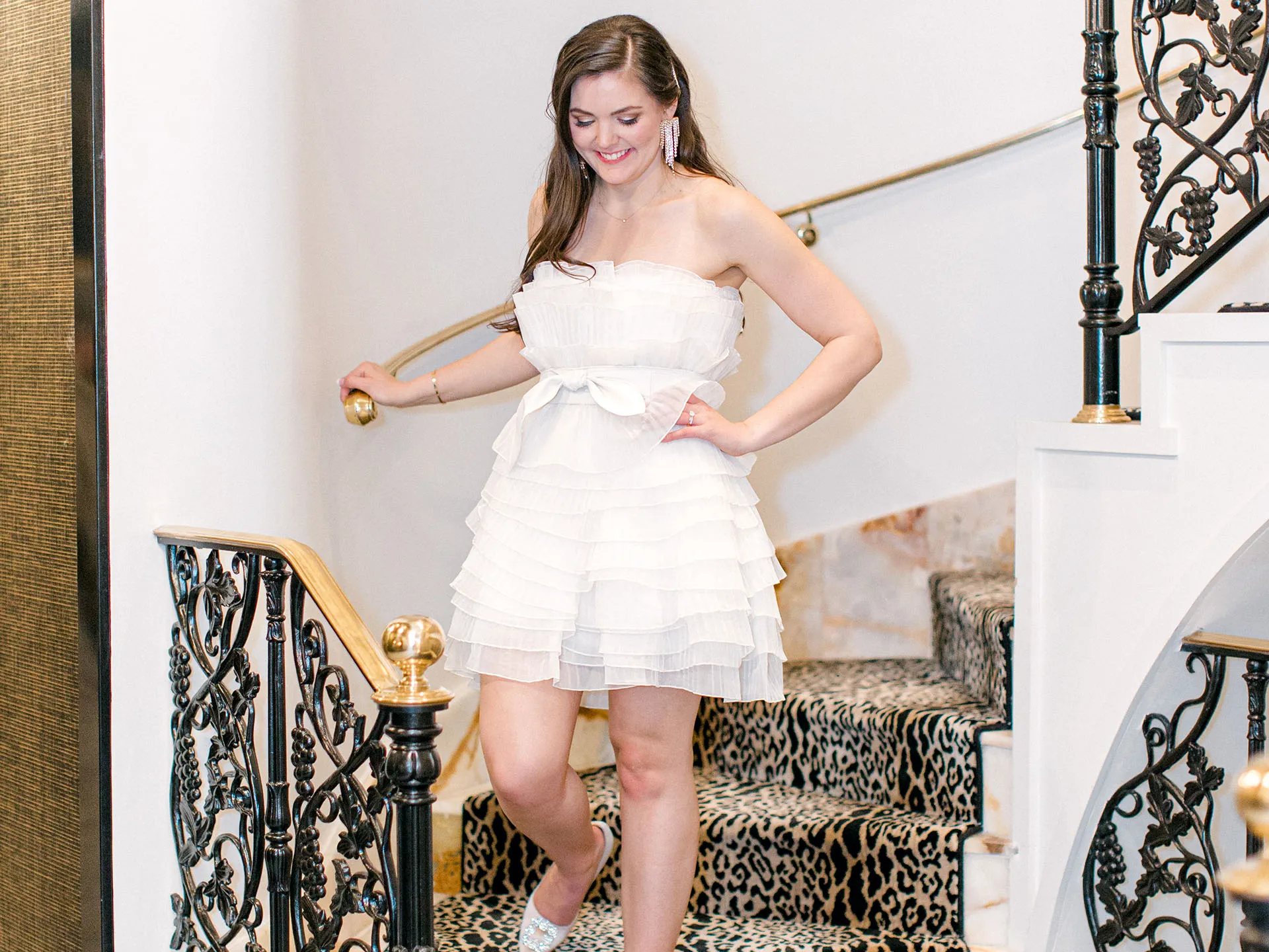 Wedding Bride coming downstairs in second dress